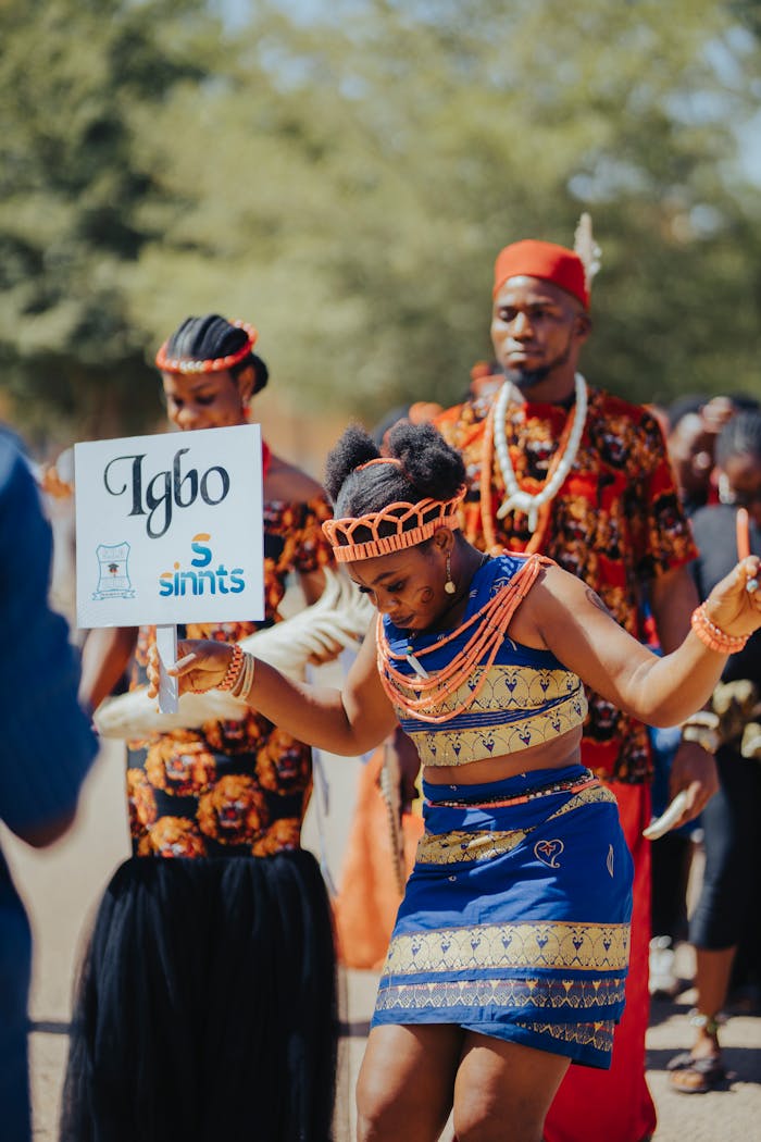 who-we-are Colorful Igbo cultural parade showcasing traditional attire and dance.